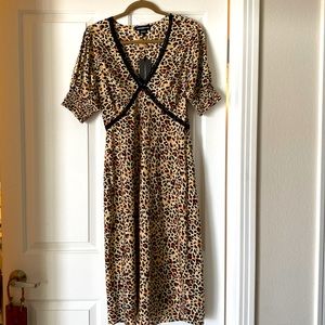 Chic ‘’Wednesday’sGirl’’ below the knee dress. Dress it up or dress it down!